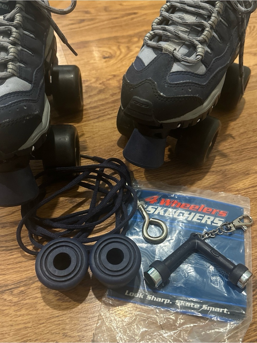 Kids size 3 Skechers Navy and Gray Quad Roller Skates with Accessories Like New